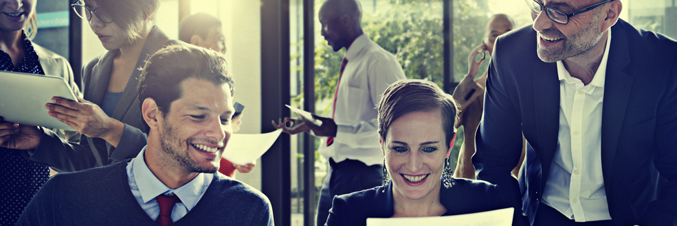 3 Persons discussing a paper